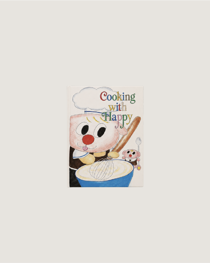 A square art print featuring a whimsical illustration of a cartoon character in a chef hat mixing batter, with the text 'Cooking with Happy' above, shown against a light gray background.